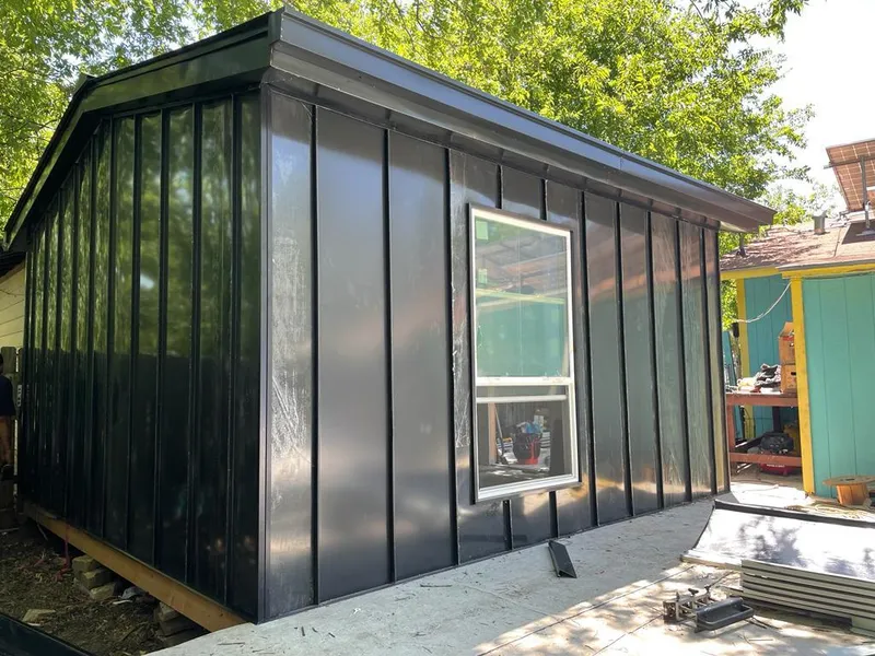 Black standing seam metal wall panels for Roof Inspection in Millstone